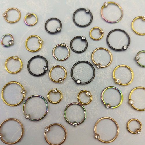 Кольцо 1,2 мм. Титан. Шарик с кристаллом, радужное анодирование. BCRTCA16rb