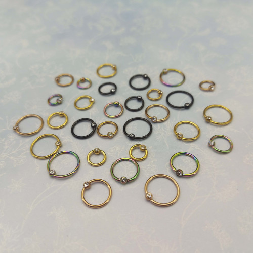 Кольцо 1,2 мм. Титан. Шарик с кристаллом, золотое анодирование. BCRTCA16g